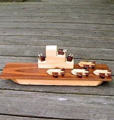 a wooden model of a boat on a deck