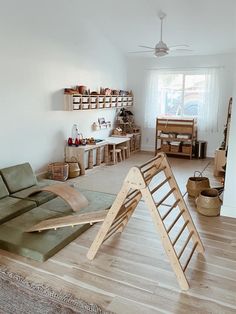 a living room filled with furniture and shelves