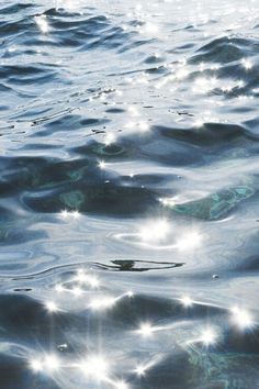 the sun shines brightly in the water as it reflects on the surface and creates an interesting pattern