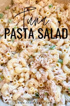 pasta salad with tuna and peas in a white bowl