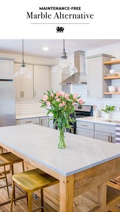 a large kitchen with an island in the middle