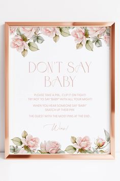 a pink rose frame with the words don't say baby on it and flowers