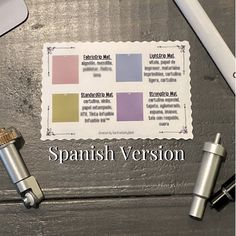 an image of a spanish version paper with some type of pen and two other items