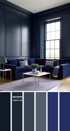 a living room with dark blue walls and furniture