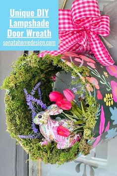 a flower pot hanging from the side of a door with moss and flowers in it