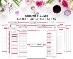 the student planner is set up on top of a table with flowers and other items