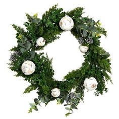 a wreath with white flowers and greenery