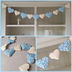 some paper hearts hanging from a shelf with flowers and daisies on them in different stages of being cut out