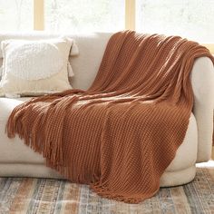 a couch with a blanket on top of it