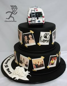 a three tiered cake decorated with photos and an ambulance on the top is black