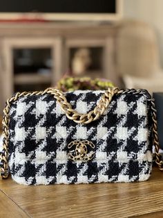 Chanel 19 Black White Houndstooth SMALL (rare! the 19 houndstooth was not assorted in this size for North America, bought it from Japan CHANEL boutique) PP Invoice and shipped: $7000 9.5/10 (used less than 10 times) Comes with full set (receipt, box, dustbags, tissues, authenticity card) All Sales Final, Serious buyers only! Feel free to ask any questions. The sizing is kind of confusing/misleading for 19s especially. Being 5'2, the medium looked huge on me but was obsessed w/the bag when it first came out that I was willing to pay a huge premium w/a reputable reseller (have real receipts) for the small which was available in Europe/Asia. For the 19s, the "small" is more like the classic flap medium and the "medium" is more like a jumbo. Due to the nature of the design of the bag, the smal Chanel Fabric Bag, Tas Louis Vuitton, Bag Obsession, Chanel Inspired, Luxury Purses, Holy Grail, Cute Bags, Fabric Bag, Fashion Editor