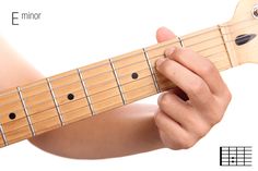 someone is playing an electric guitar with their fingers