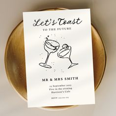 a card that says let's toast to the future with two glasses of wine