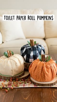 three pumpkins sitting on top of a wooden table next to a white couch with text overlay that reads, toilet paper roll pumpkins