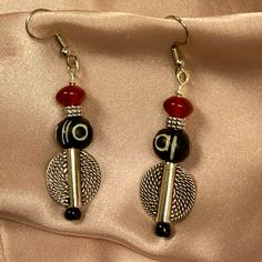 Offering A Brand New, Handmade Pair Of Drop Earrings Featuring A Textured .5” Shield, A 10mm Black & Cream, Silver Spacer & Red Rondel. These Earrings Are Set On Silver Wire With Stainless Steel Ear Wires. They Are Approx. 2” In Length. Treat Yourself Or Treat Someone Special! Red Dangle Beaded Metal Earrings, Southwestern Red Earrings With Dangling Beads, Orange Dangle Earrings With Black Beads, Artisan Red Earrings With Dangling Beads, African Earrings Handmade Inspire Uplift ⭐, Beaded Jewelry Necklaces, Black Cream, Silver Wire, Ear Wires