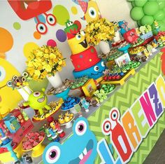 a colorful birthday party with lots of food and decorations