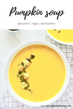 two bowls of pumpkin soup on top of a white table with the title above it