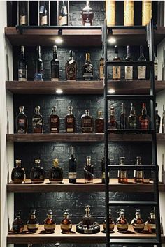 the shelves are filled with different types of liquor