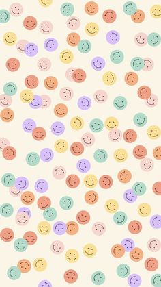 many different colored smiley faces on a white background with pink, blue and green circles