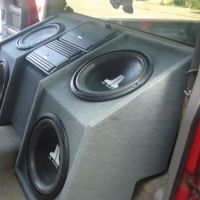 the inside of a car with speakers in it