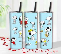 three tumblers with snoopy characters on them