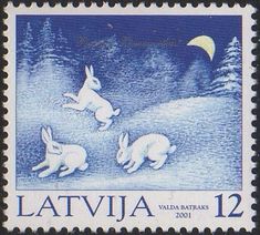 a postage stamp with three rabbits in the snow at night, and an moon above them