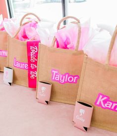 pink and brown bags with name tags on them