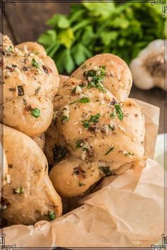 These homemade garlic knots are soft, fluffy and perfect to serve as an appetizer or side dish with any pasta dinner! These are easy to make with homemade pizza dough and a garlic herb topping. Enjoy on their own or dipped in your favorite marinara sauce!