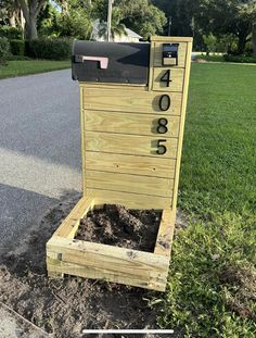 a mailbox sitting in the middle of some dirt