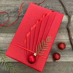 red envelope with christmas decorations on wooden table