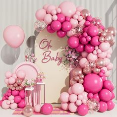 a baby shower with pink balloons and other items in front of the sign that says, oh baby