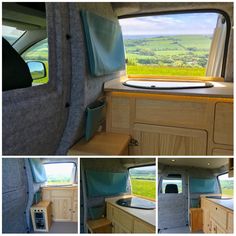 the inside of a camper van with windows and storage compartments on each side, looking out onto rolling green hills