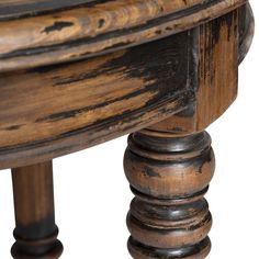 an old wooden table with black paint on the top and bottom edge, against a white background