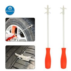 two wrenches are being used to fix a car tire with an orange plastic handle