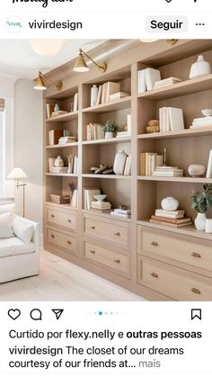 a wooden bookcase filled with lots of books and vases on top of it