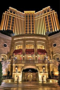 the las vegas hotel and casino is lit up at night