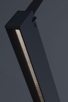 a close up view of a street light on a gray background with no people in it