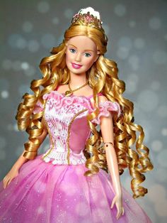 a barbie doll wearing a pink dress and tiara