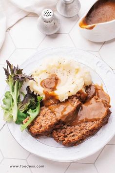 meatloaf with mashed potatoes and gravy on a plate