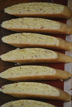 several pieces of bread sitting on top of a table next to each other in rows