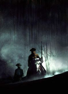 two men riding horses in the dark with fog coming from their backs and trees behind them