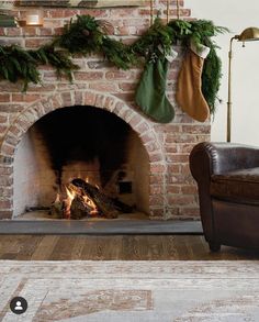 a fireplace with stockings hanging over it