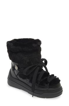 The label's signature mountaineering warmth is highlighted through the plush faux-fur paneling of this leather snow boot complete with an ultragrippy traction sole. Lace-up style Leather and textile faux-fur upper/textile and textile faux-fur lining/rubber sole Imported Designer Shoes Snow Shoes Women, Black Fur Boots, Fur Boots Women, Fur Snow Boots, Leather Snow Boots, Snow Boot, Snow Boots Women, Quilting Tips, Snow Shoes