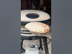 there is a piece of bread on top of an oven and it's cooking