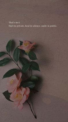 some pink flowers on a white wall with a quote above it that says, that's next