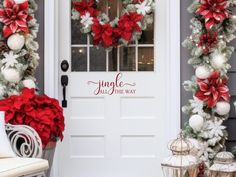 the front door is decorated for christmas with poinsettis and wreaths