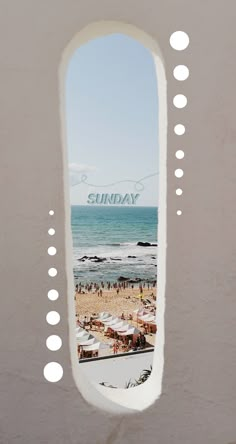 a window with the words sunday on it and people at the beach in the background