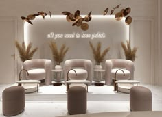 an all you need is love polish salon with chairs and stools in front of a white wall