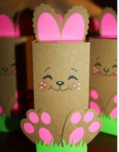 some brown paper bags with pink bunny ears on them