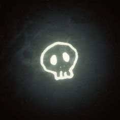 a glowing skull in the dark with two eyes